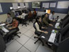 Photo of 8 air traffic controller simulation workstations.